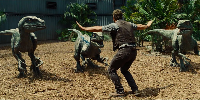 Chris Pratt attempts to tame velociraptors in "Jurassic World"