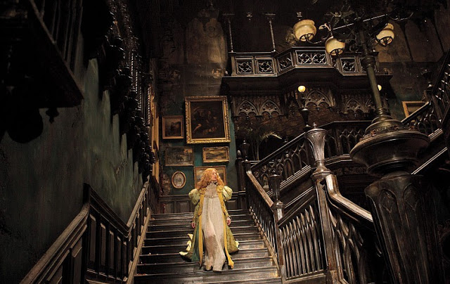 Mia Wasikowska enters a haunted house in Guillermo del Toro's "Crimson Peak"