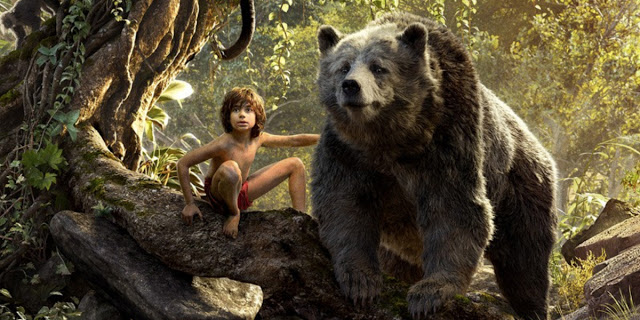 Neel Sethi as Mowgli, alongside Bill Murray's Baloo, in "The Jungle Book"