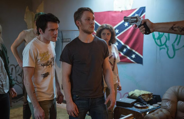 Anton Yelchin, Joe Cole, and Alia Shawkat, trapped in "Green Room"