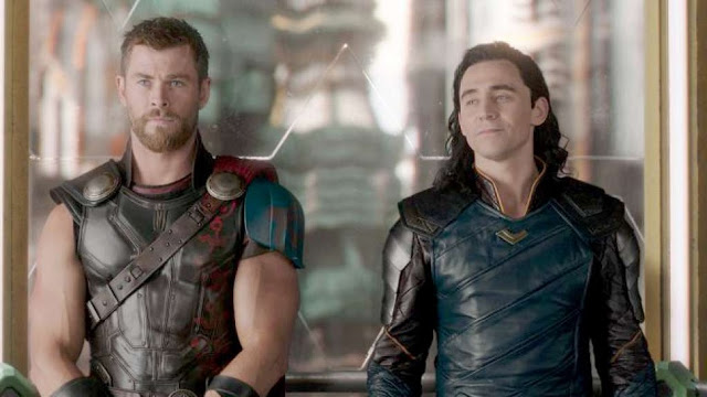 Chris Hemsworth and Tom Hiddleston smirk and squabble in "Thor: Ragnarok"