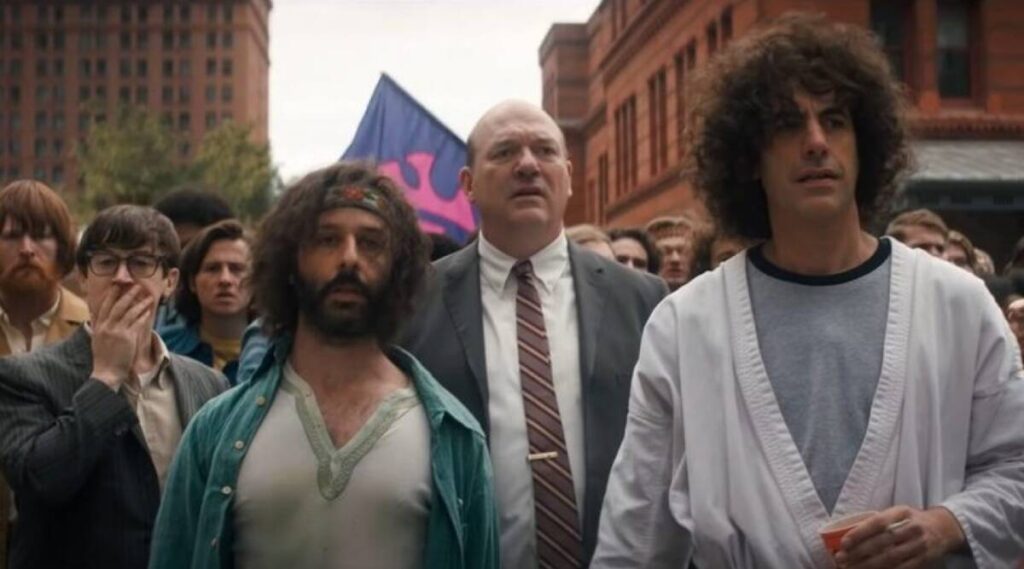 Jeremy Strong, John Carroll-Lynch, and Sacha Baron Cohen in Aaron Sorkin's "The Trial of the Chicago 7"