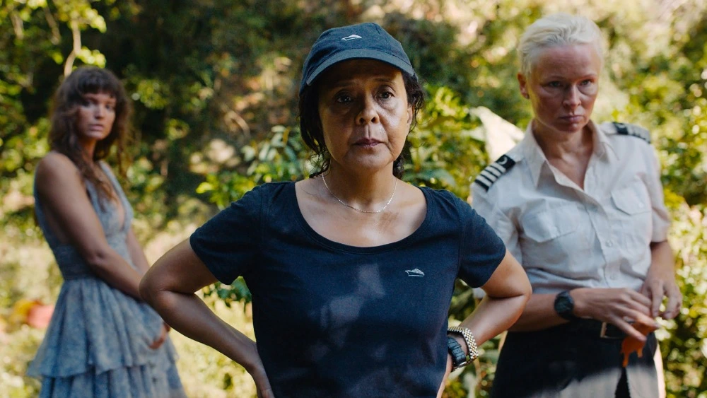 Charlbi Dean, Dolly De Leon, and Vicki Berlin in Triangle of Sadness