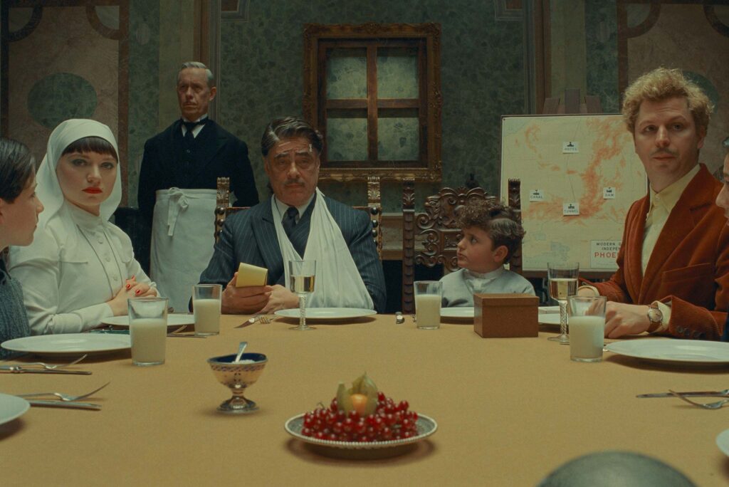 Mia Threapleton, Benicio Del Toro, and Michael Cera in The Phoenician Scheme