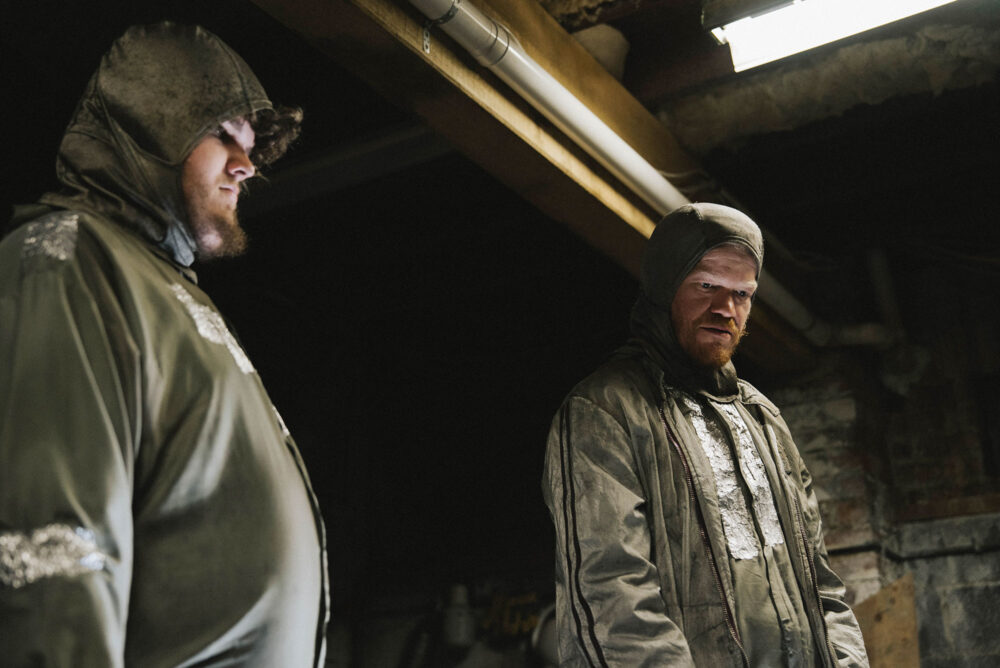 Aidan Delbis and Jesse Plemons in Bugonia