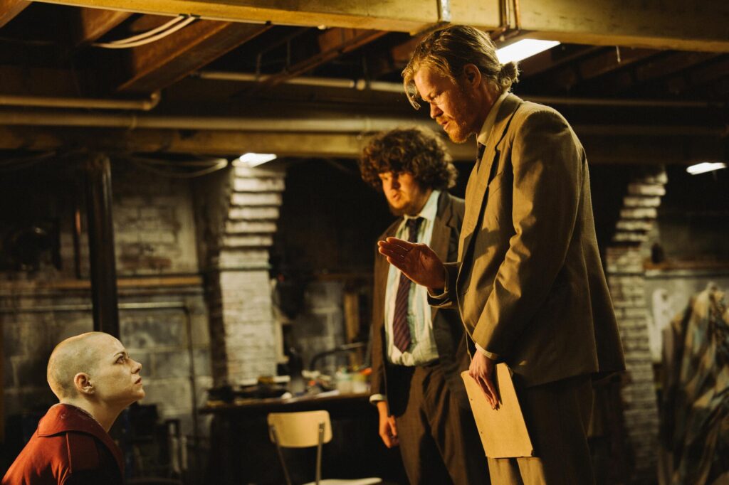 Emma Stone, Jesse Plemons, and Aidan Delbis in Bugonia