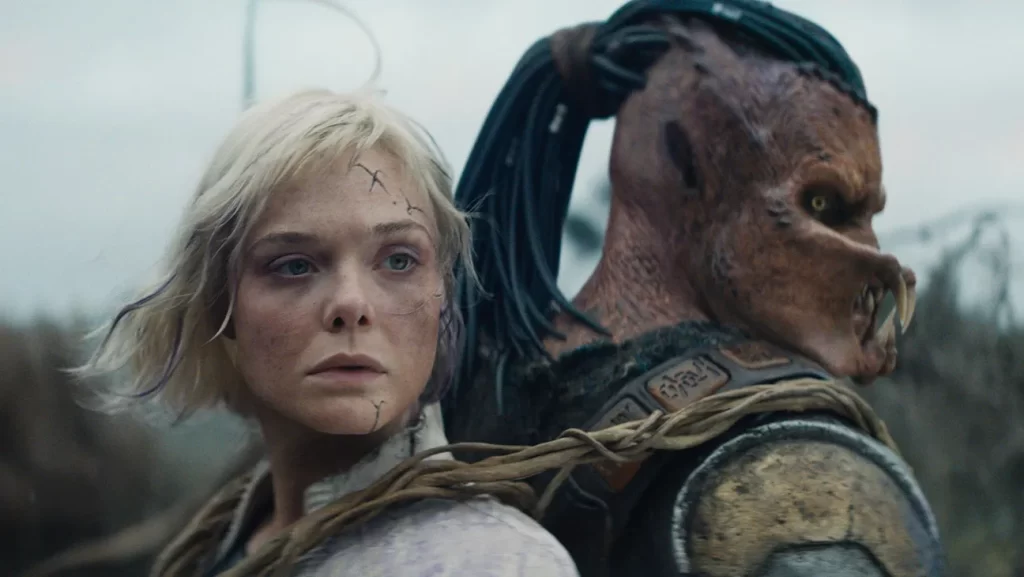 Elle Fanning and Dimitrius Schuster-Koloamatangi in Predator: Badlands